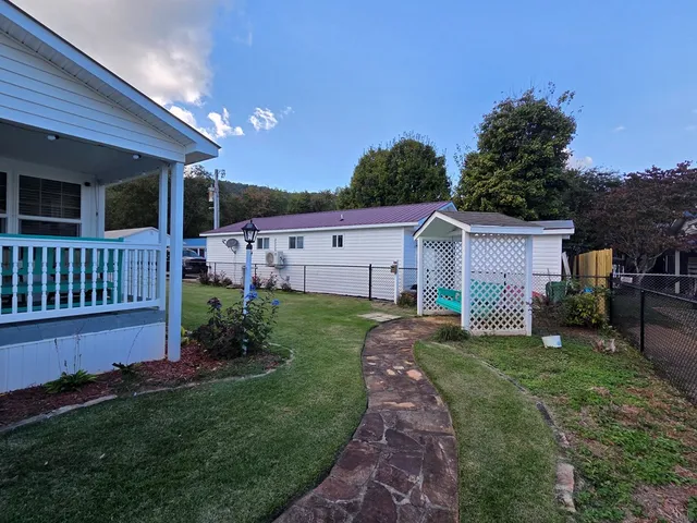 a view of a house with a back yard