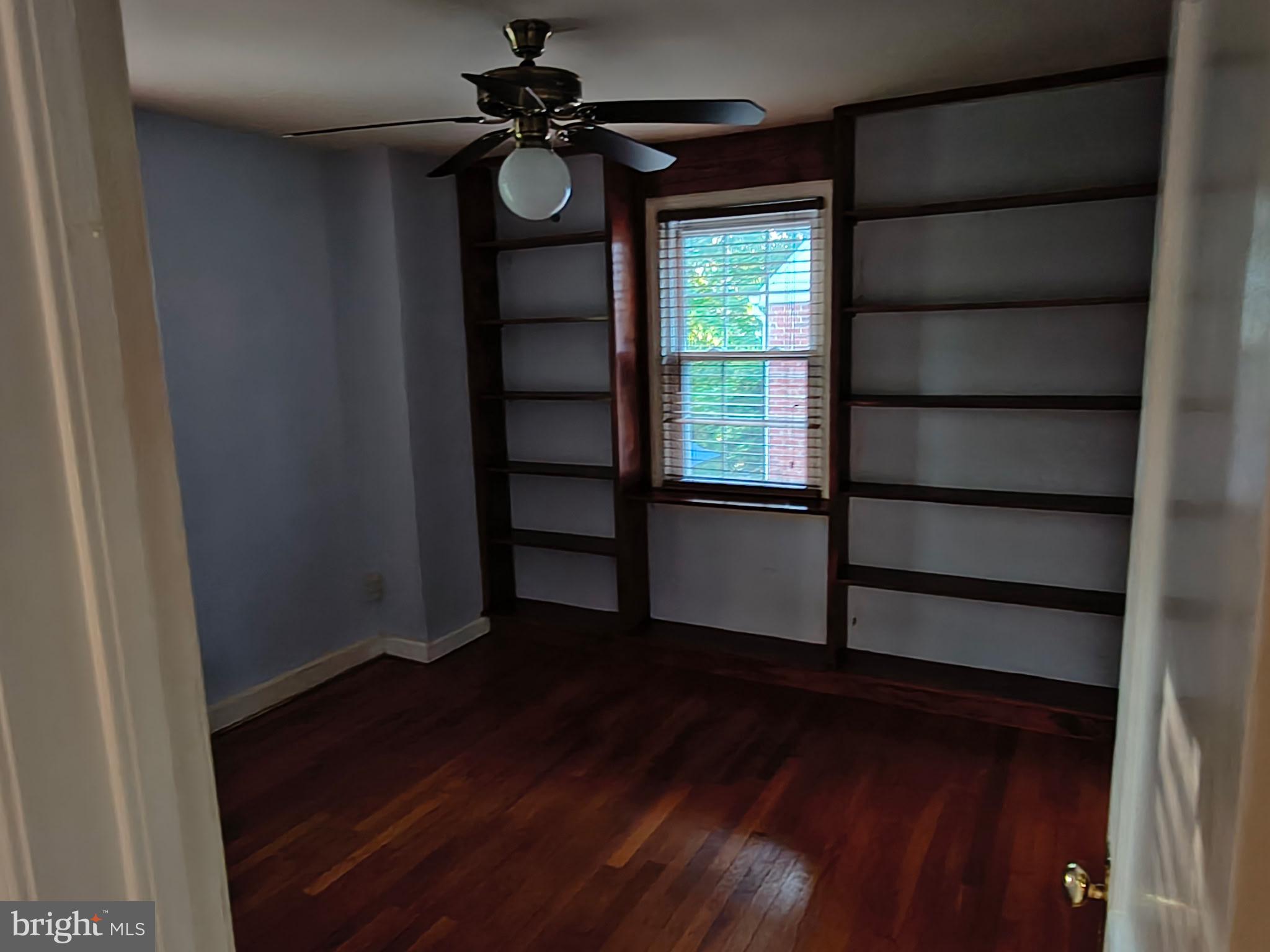 9316 Sudbury Road Silver Spring, MD 20901 - Photo 5 of 19 a view of a livingroom with wooden floor and window