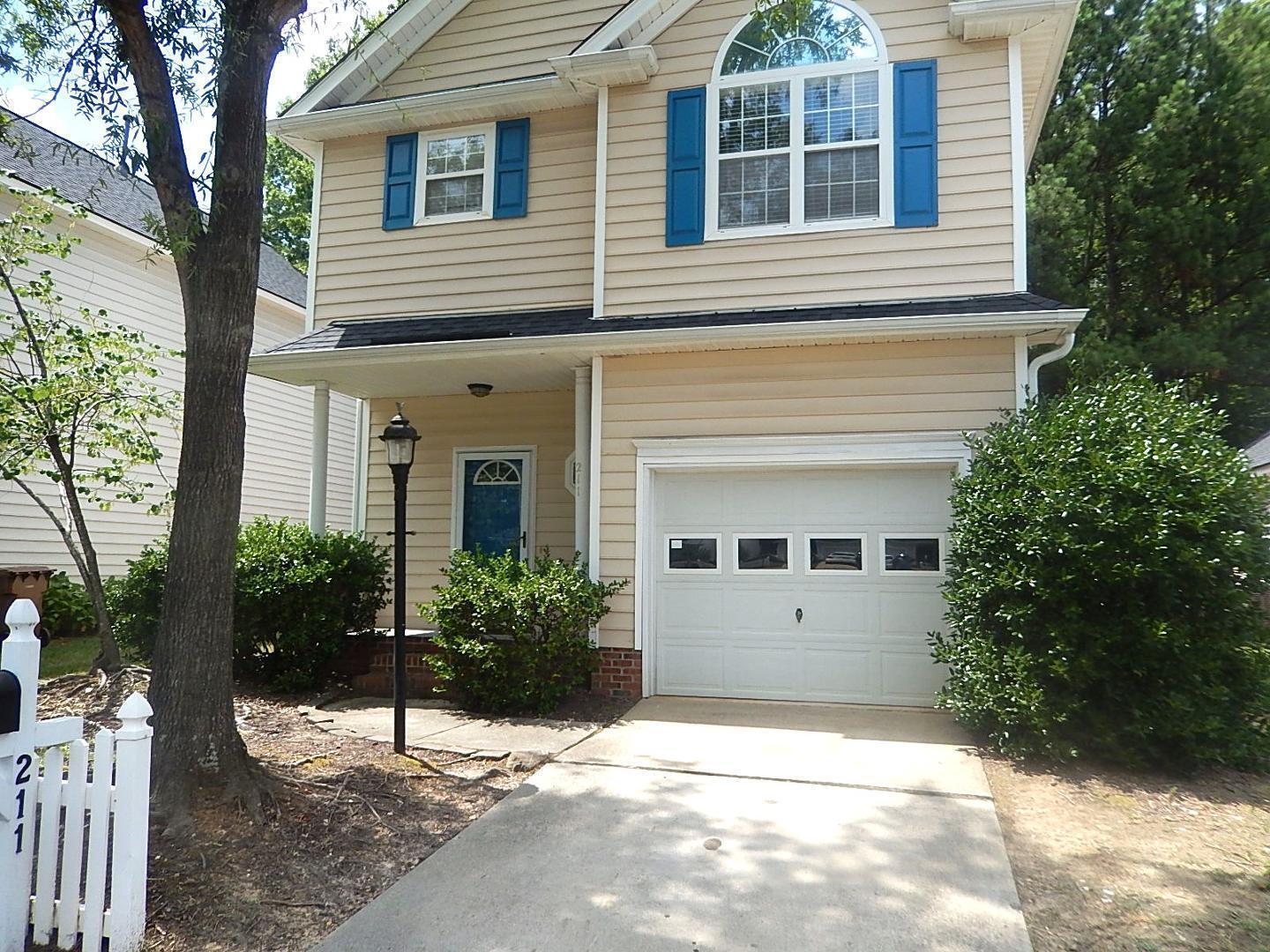211 Bridgepath Drive Cary, NC 27513 - Photo 1 of 26 a view of a house with a yard and potted plants