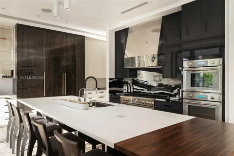 a large white kitchen with a large tub and shower