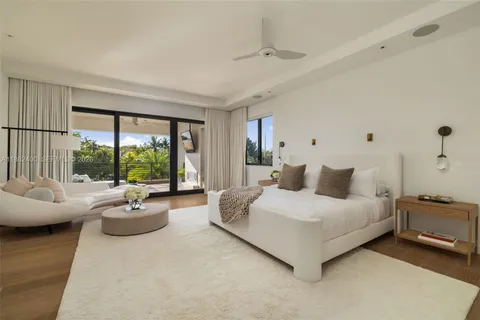 a bed room with a bed and a window