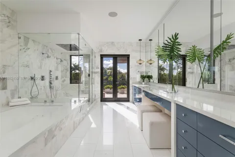 a view of a swimming pool with a patio and a garden