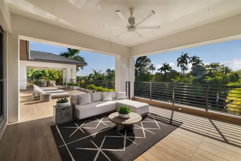 a view of swimming pool with outdoor seating and lake view