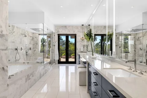 a view of a balcony with furniture and a floor to ceiling window