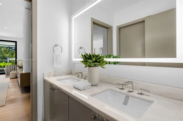 a living room with fireplace furniture and a floor to ceiling window