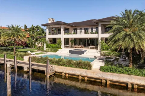 a view of a palm trees in front of a house
