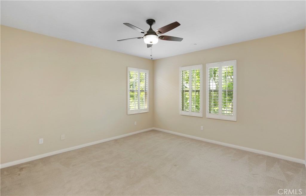 64 Prickly Pear Irvine, CA 92618 - Photo 14 of 35 an empty room with window and ceiling fan