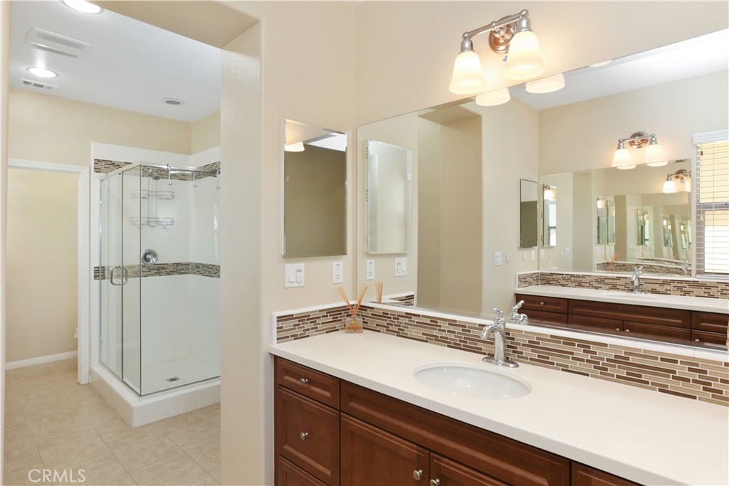 64 Prickly Pear Irvine, CA 92618 - Photo 17 of 35 a bathroom with a double vanity sink mirror and double