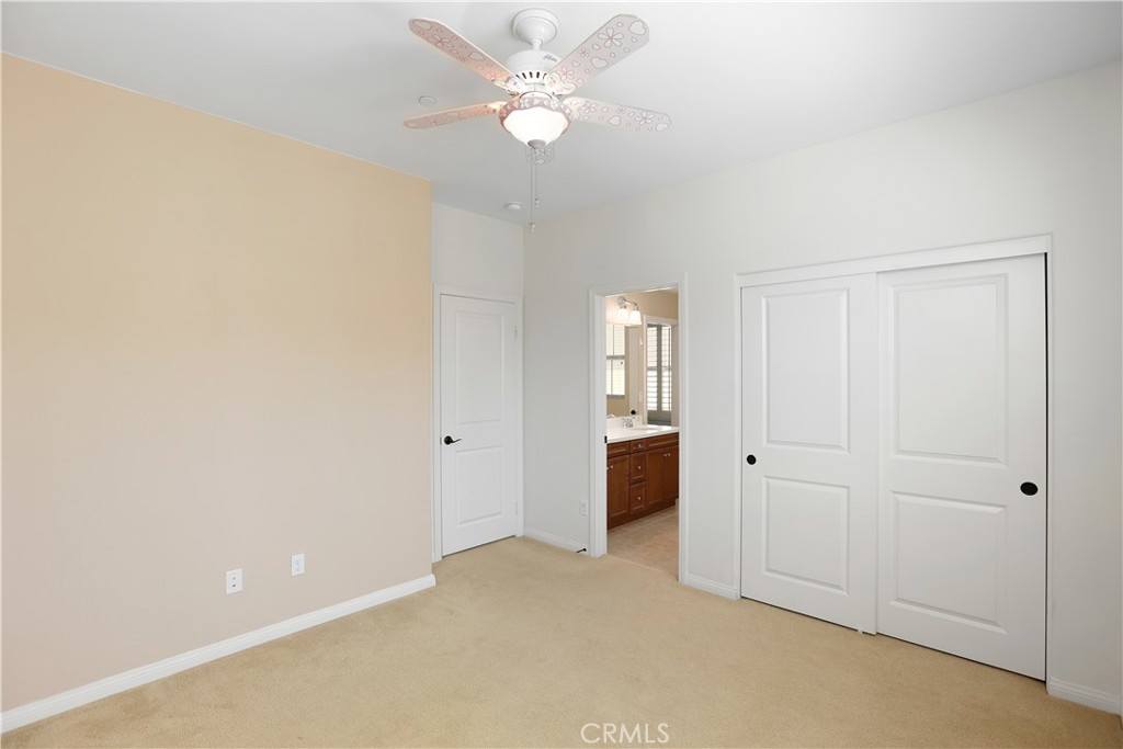 64 Prickly Pear Irvine, CA 92618 - Photo 19 of 35 an empty room with a ceiling fan and a window