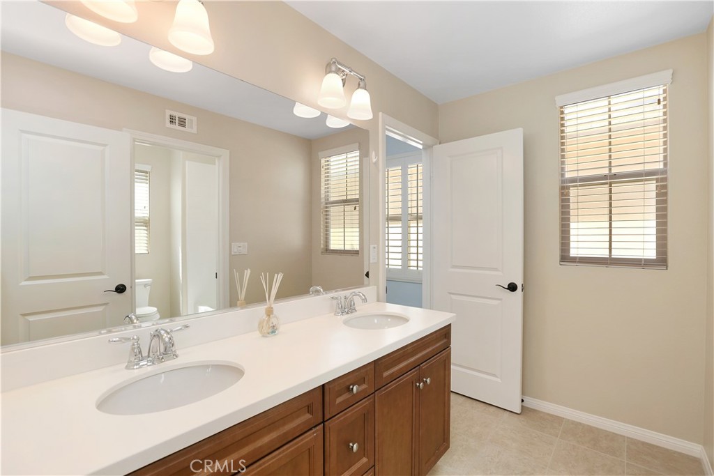 64 Prickly Pear Irvine, CA 92618 - Photo 20 of 35 a bathroom with a sink double vanity and a mirror