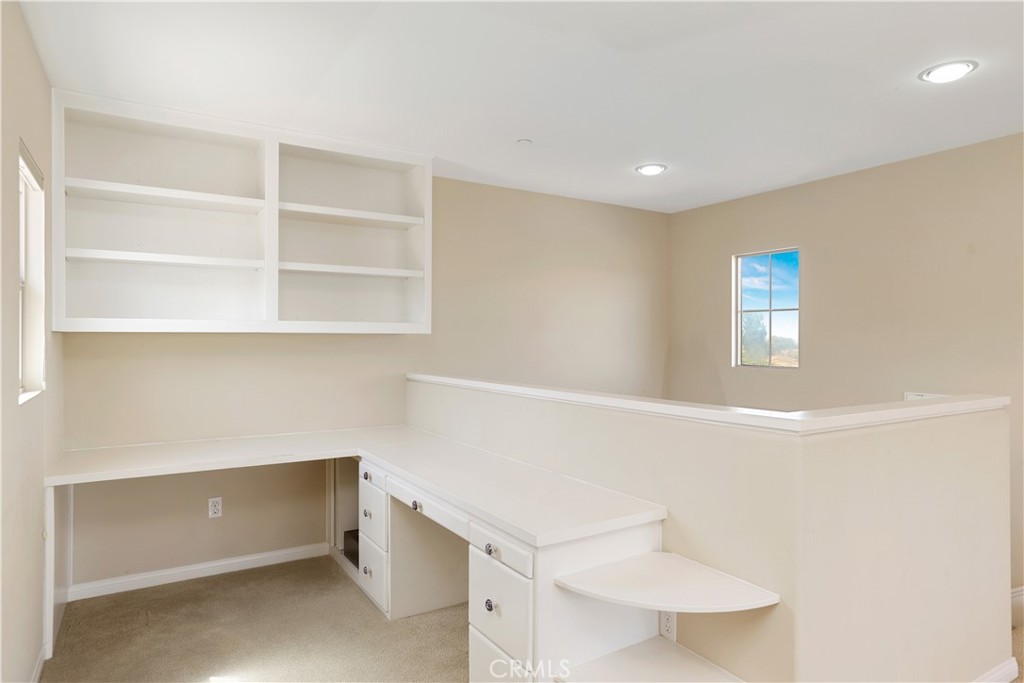 64 Prickly Pear Irvine, CA 92618 - Photo 25 of 35 a room with a desk and white walls