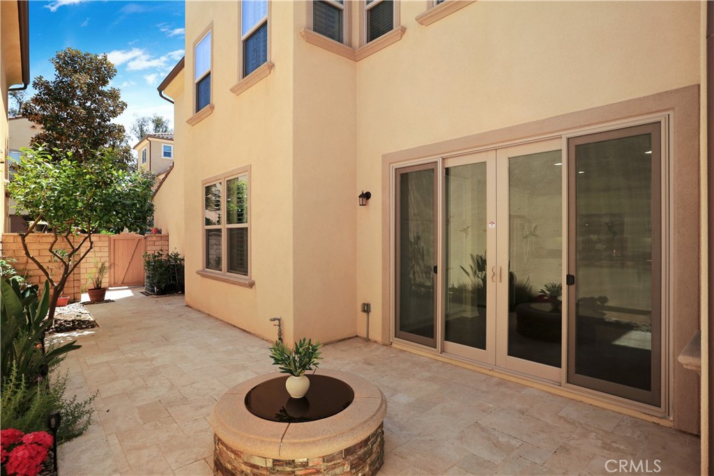 64 Prickly Pear Irvine, CA 92618 - Photo 27 of 35 a view of a porch with a table and chairs