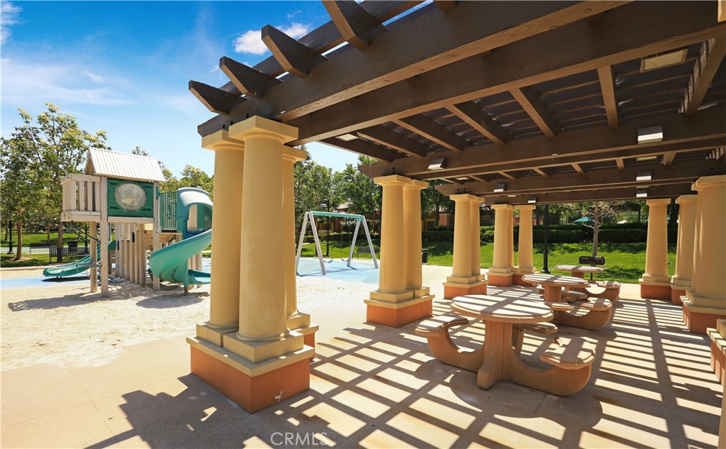 64 Prickly Pear Irvine, CA 92618 - Photo 35 of 35 a view of a patio with table and chairs potted plants with floor to ceiling window