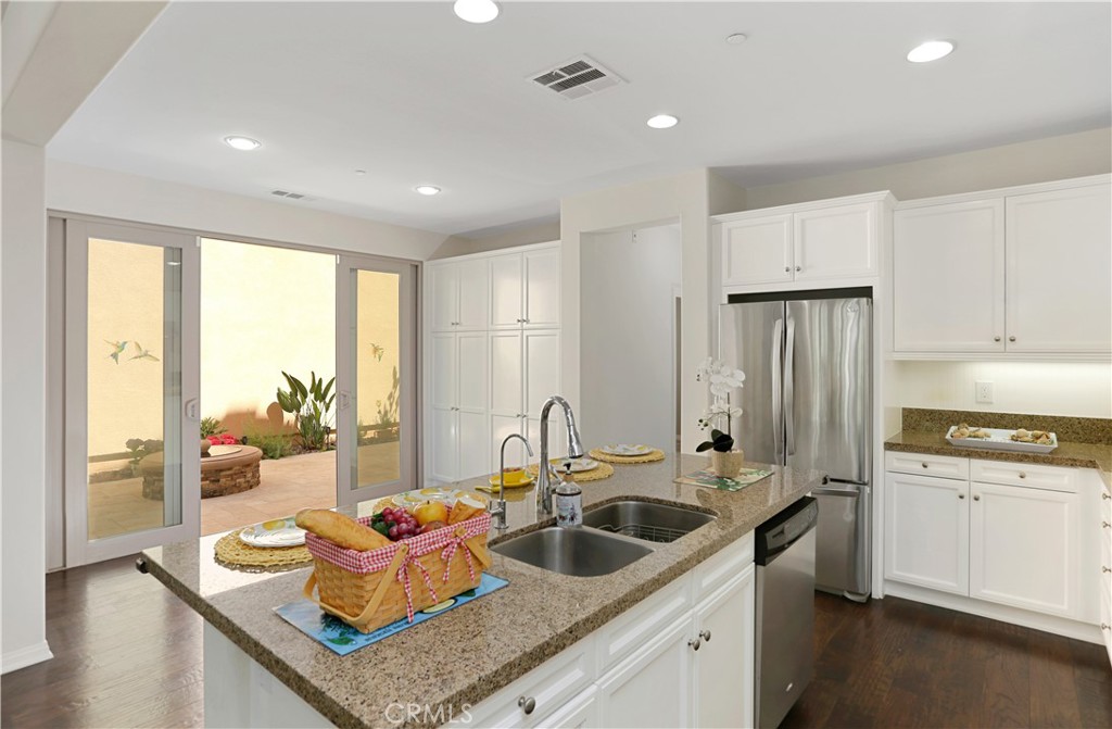 64 Prickly Pear Irvine, CA 92618 - Photo 7 of 35 a kitchen with a sink stove and refrigerator