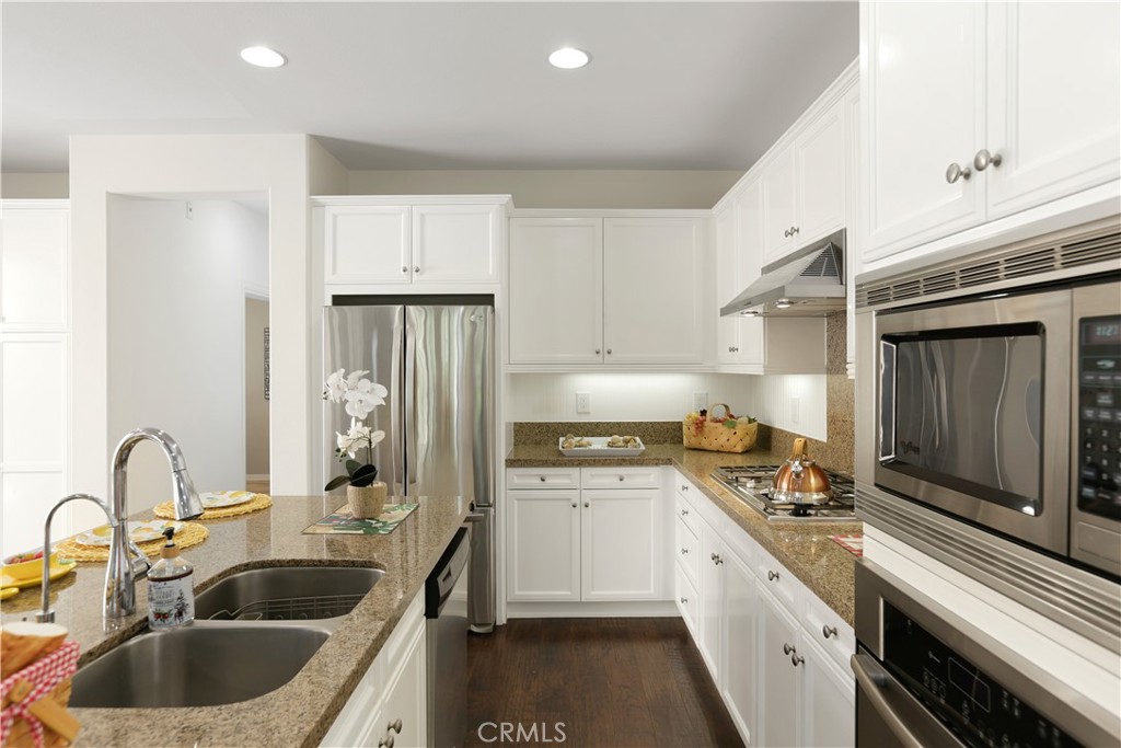 64 Prickly Pear Irvine, CA 92618 - Photo 9 of 35 a kitchen with a sink cabinets and stainless steel appliances