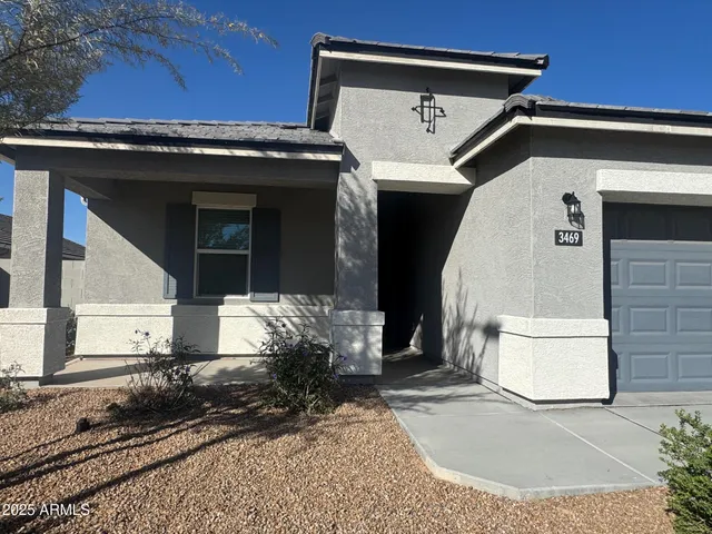 a view of kitchen with kitchen island stainless steel appliances a refrigerator a stove a microwave and a sink