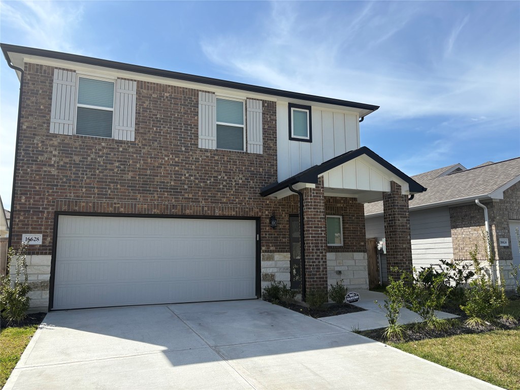 16628 Sterling Clf Street Conroe, TX 77302 - Photo 1 of 14 a front view of a house with garden