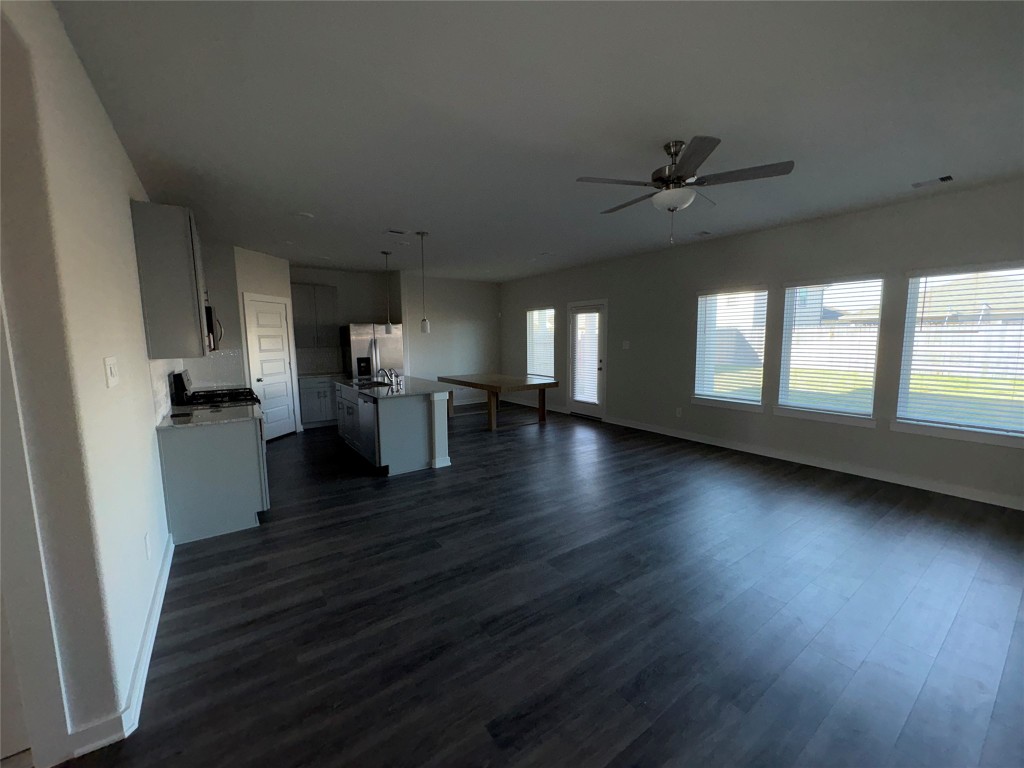 16628 Sterling Clf Street Conroe, TX 77302 - Photo 11 of 14 a view of empty room with wooden floor and fan