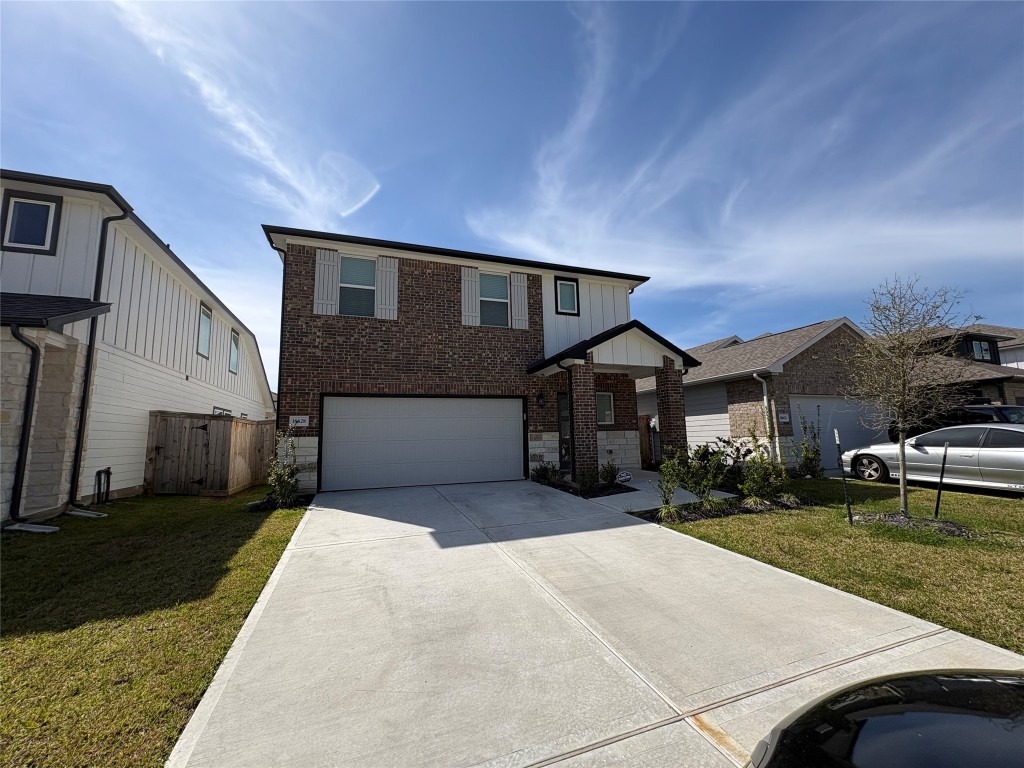 16628 Sterling Clf Street Conroe, TX 77302 - Photo 14 of 14 a front view of a house with a yard and garage