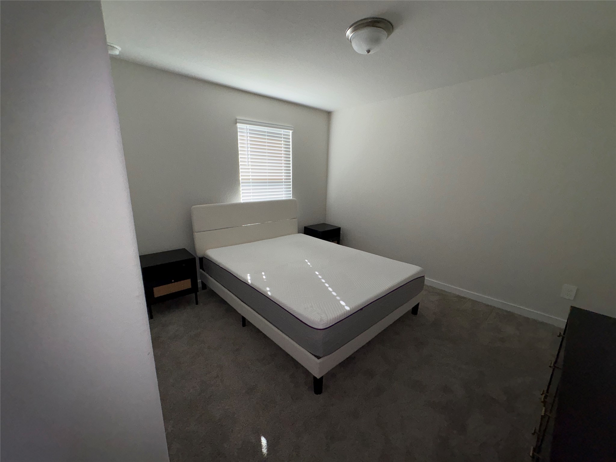 16628 Sterling Clf Street Conroe, TX 77302 - Photo 7 of 14 a bedroom with a bed and window