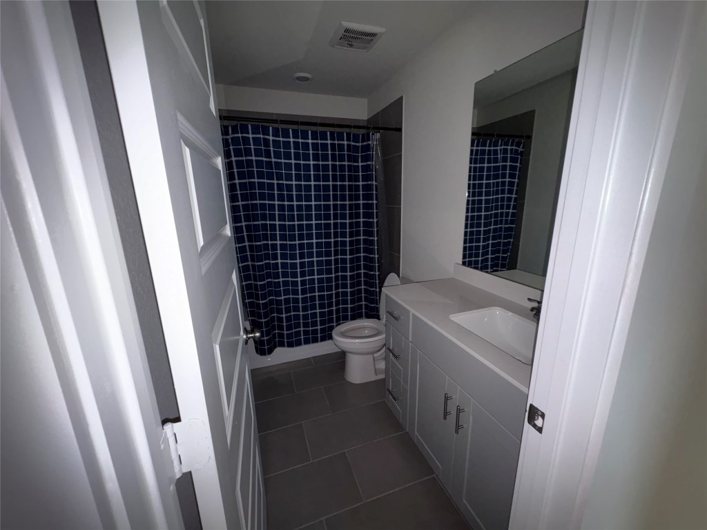 16628 Sterling Clf Street Conroe, TX 77302 - Photo 8 of 14 a bathroom with a toilet and a shower