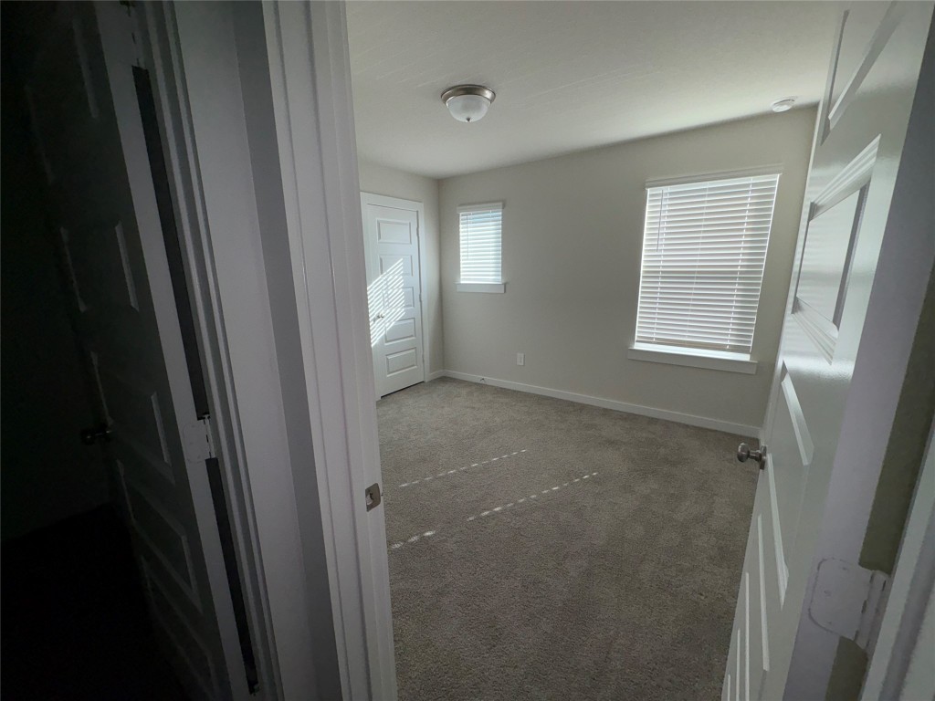 16628 Sterling Clf Street Conroe, TX 77302 - Photo 9 of 14 a view of an empty room with a window