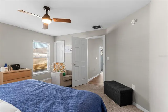 a bedroom with a bed and a dresser