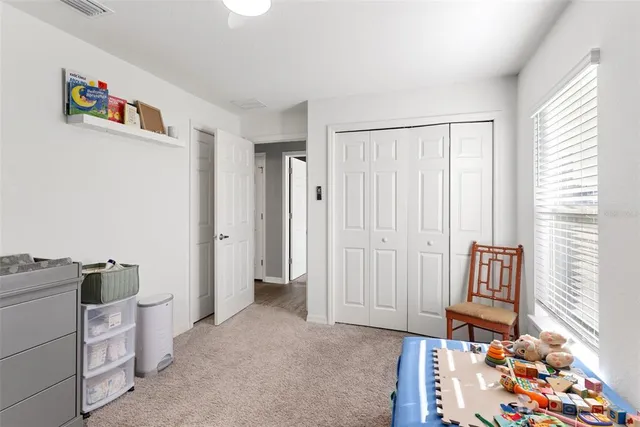 a view of room with window and furniture