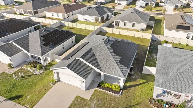 a view of a patio with table and chairs