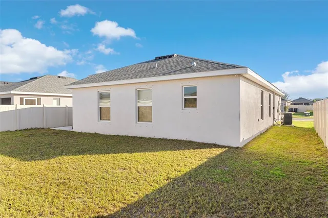 an aerial view of residential building with parking space