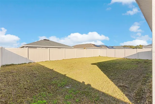 an aerial view of residential houses and outdoor space