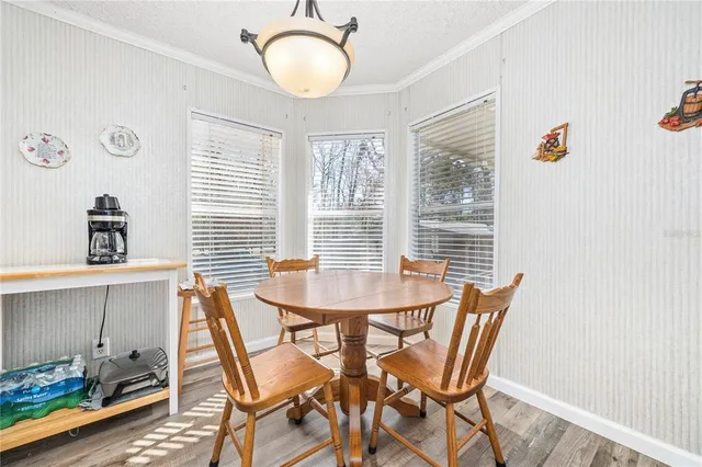 a dining room with furniture and window