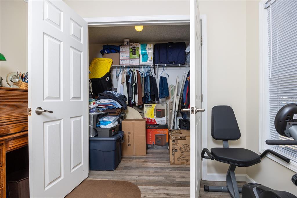 3964 288th Street Branford, FL 32008 - Photo 19 of 37 a view of walk in closet with clothes and shoes