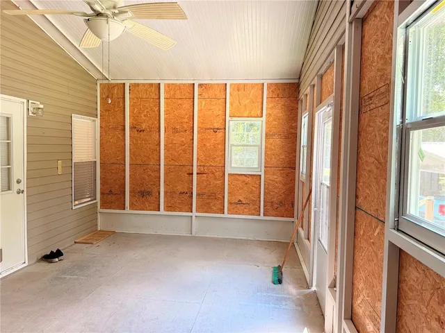 a view of an empty room with a window