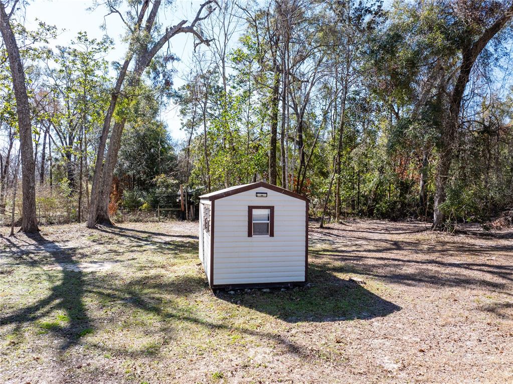 3964 288th Street Branford, FL 32008 - Photo 26 of 37 a view of a wooden floor and a yard