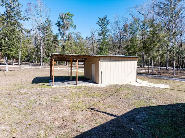 a backyard of a house with lots of green space