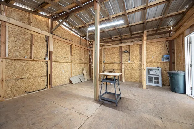 a view of a room with wooden chairs and furniture