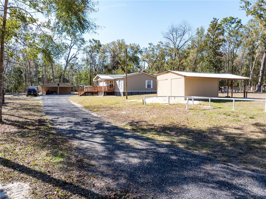 3964 288th Street Branford, FL 32008 - Photo 32 of 37 a front view of a house with a yard