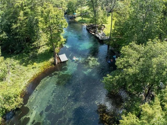 a view of a lake with a yard