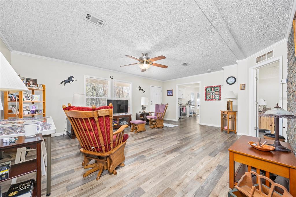 3964 288th Street Branford, FL 32008 - Photo 5 of 37 a living room with furniture and a wooden floor