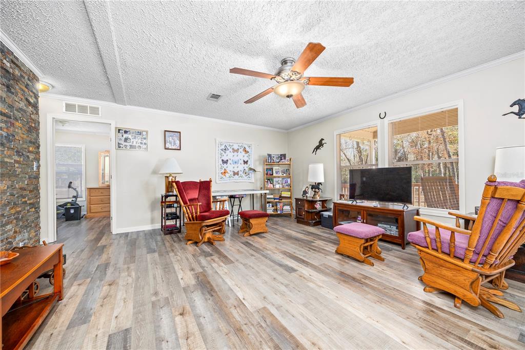 3964 288th Street Branford, FL 32008 - Photo 7 of 37 a living room with furniture and a flat screen tv