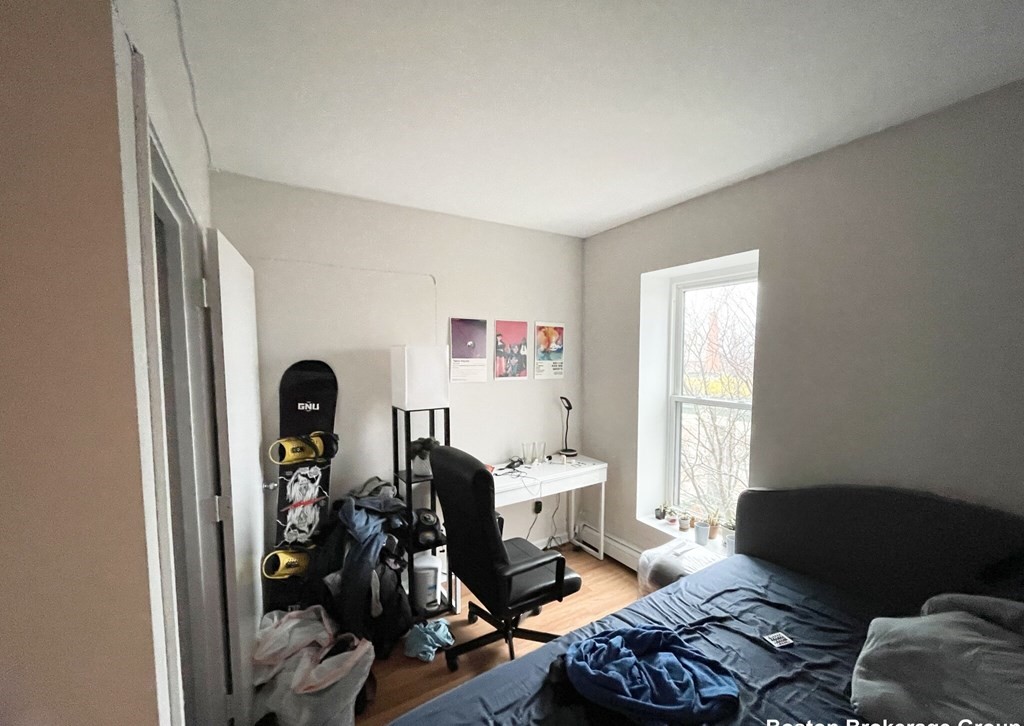 90 Hammond Street, Unit 5 Boston, MA 02120 - Photo 4 of 6 a bedroom with furniture and a window