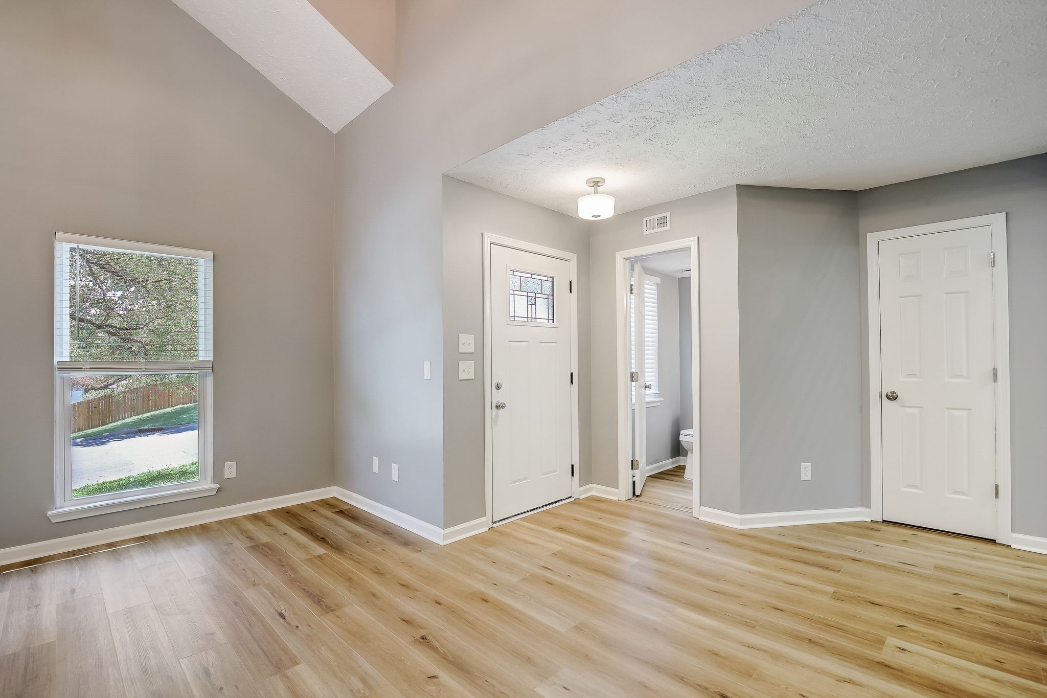 861 Bishopsgate Road Antioch, TN 37013 - Photo 3 of 33 a view of empty room with wooden floor and window
