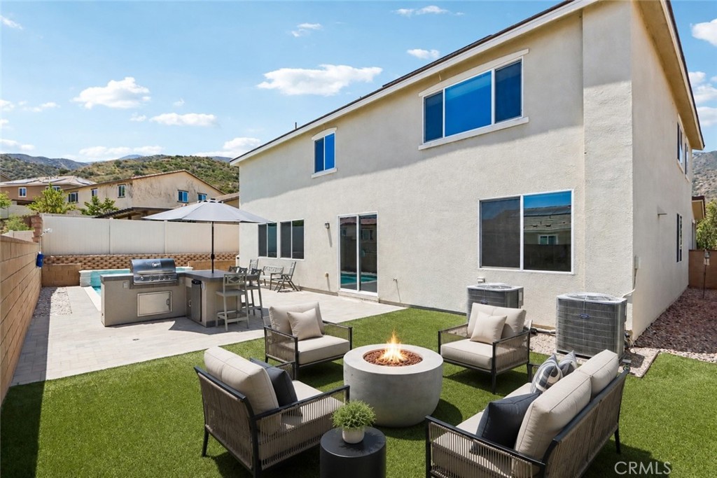 11056 Guffey Ranch Way Corona, CA 92883 - Photo 43 of 61 a view of a patio with couches chairs and potted plants