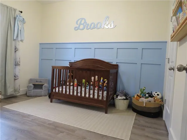 a bedroom with a bed and a couch