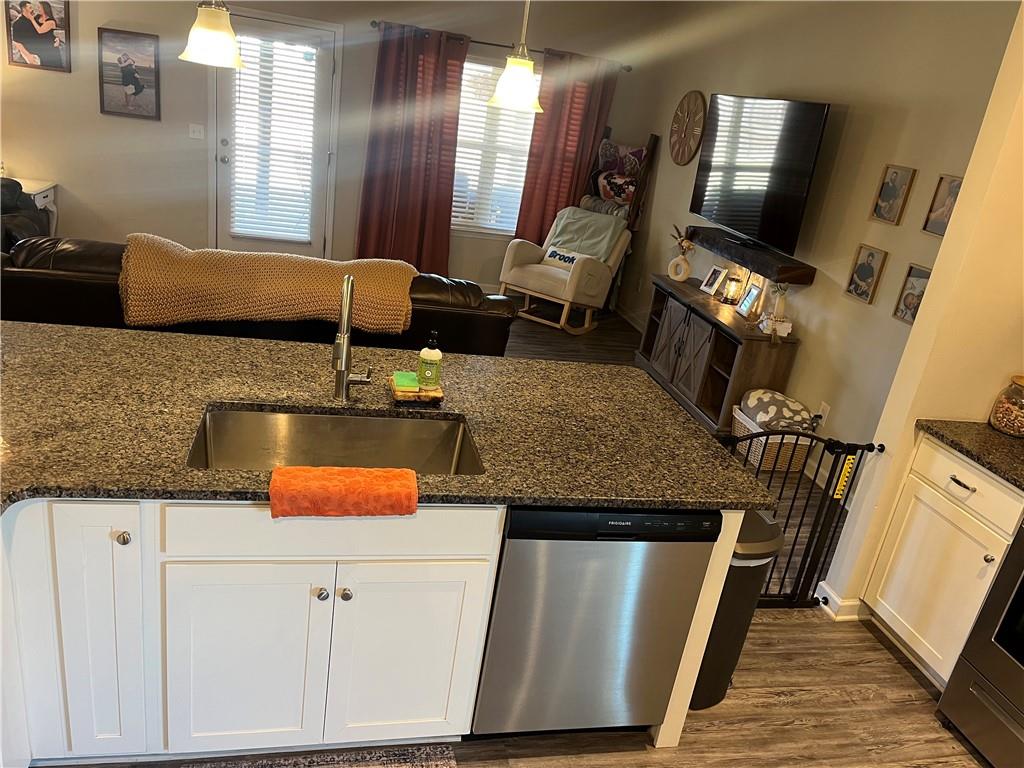 5 Willowrun Drive Rome, GA 30165 - Photo 16 of 43 a living room with stainless steel appliances granite countertop furniture and a flat screen tv