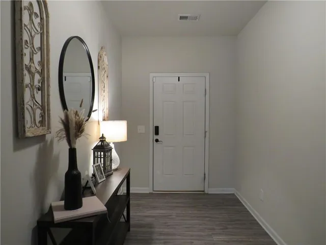 a view of a livingroom with furniture and wooden floor