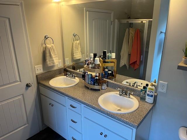 5 Willowrun Drive Rome, GA 30165 - Photo 32 of 43 a bathroom with double vanity sinks a mirror and a shower