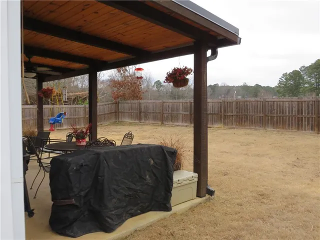 a balcony with table and chairs
