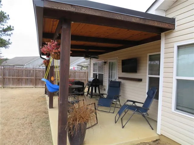 a view of a chairs and table in a patio